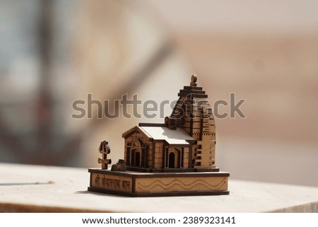a wooden figure of kedarrnath dham