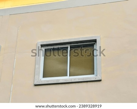 a window with a metal frame and a window.