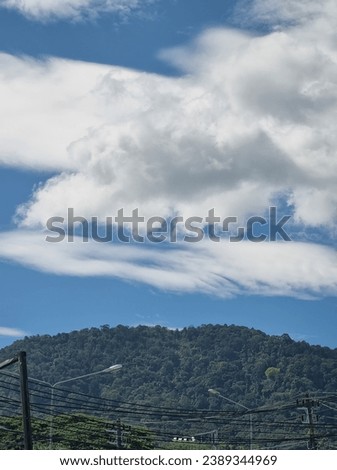 picture of a bright, clear blue sky with white clouds,