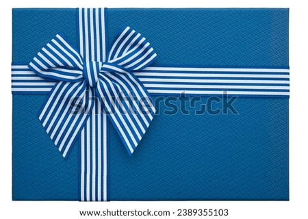 Blue goft box with striped ribbon and bow. Christmas box isolated on a white background. Closeup