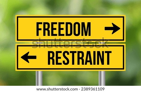 Freedom vs restraint road sign on blur background