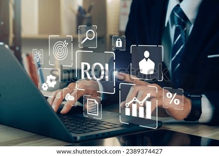 ROI,Return On Investment concept.Businessman using laptop to analysis performance measure from cost and profit efficiency.Financial growth concept. Royalty-Free Stock Photo #2389374427