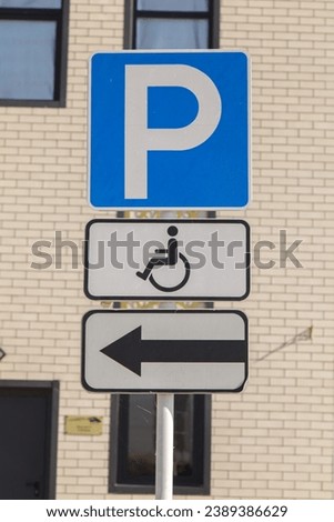 Disabled parking sign on the asphalt. Parking space with a sign for the disabled.