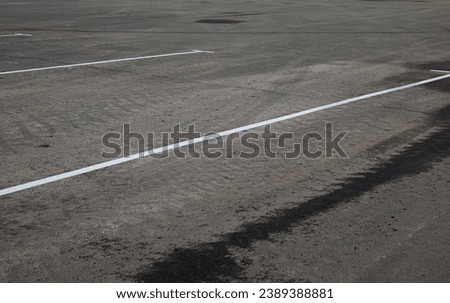 Designation of parking for cars on asphalt. Road markings.
