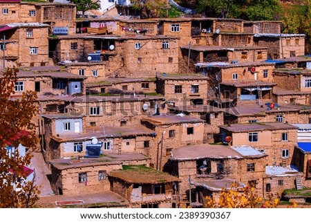 View of Hizan's historical stone houses and the social life that continues on the roofs of these houses. November, 2023. Uzuntaş, Bitlis, Turkey. Royalty-Free Stock Photo #2389390367