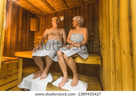 retired cute couple sweating and relaxing in the sauna and recalling their memories. High quality photo