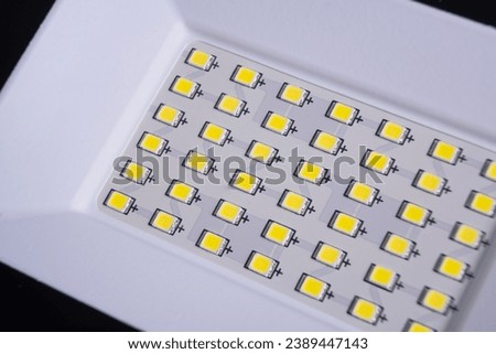 LED spotlight lamp close-up. LED diodes background. Waterproof outdoor flood lights, reflector Royalty-Free Stock Photo #2389447143