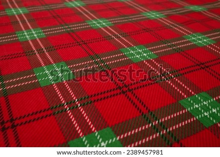 Traditional Christmas tablecloth, defocused backdrop, side view soft focus close up, for product placement