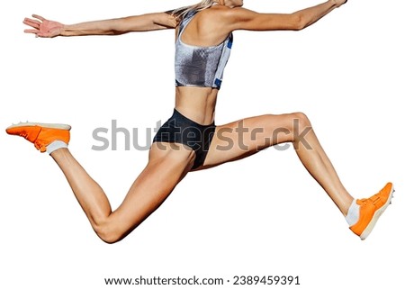 close-up female athlete jumping triple jump in summer athletics championships, isolated on white background Royalty-Free Stock Photo #2389459391