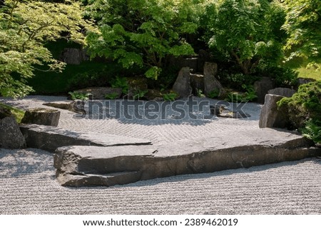 Japanese garden in summer landscape park. Traditional Buddhist rock garden.
