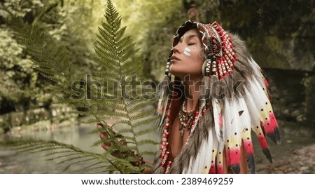 portrait of a young girl in Native American Headdresses against the background of nature