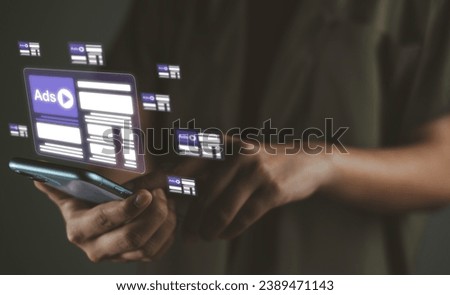 Ad (advertise)  show on smartphone display screen from advertisers on internet. Ads video banner campaign to target. Online Advertising, ad on internet, digital marketing concept. Royalty-Free Stock Photo #2389471143