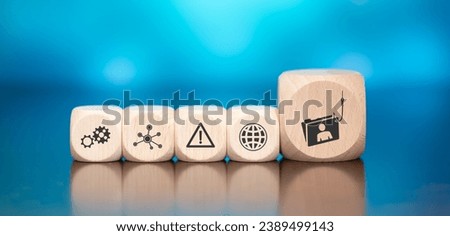 Wooden blocks with symbol of phishing concept on blue background Royalty-Free Stock Photo #2389499143