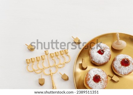 Religion image of jewish holiday Hanukkah background with menorah (traditional candelabra) and candles. top view Royalty-Free Stock Photo #2389511351