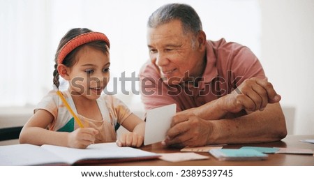 Child, senior man and learning or reading, book and education at home, drawing and support or paper. Girl, grandfather and notebook or tutoring, assessment and smile for language or math homework