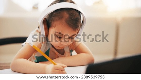 Child, writing and headphones for home education, e learning and online class on computer with audio. Girl or kid listening to virtual school, homework notes and language, translation or creativity