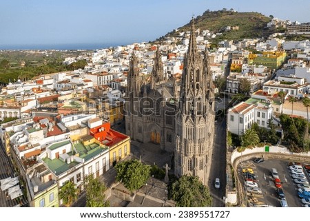 Aerial view of the Parroquia de San Juan Bautista de Arucas church in Arucas town, Gran Canaria, Canary Islands, Spain. Historic Neo-Gothic cathedral in Arucas Royalty-Free Stock Photo #2389551727