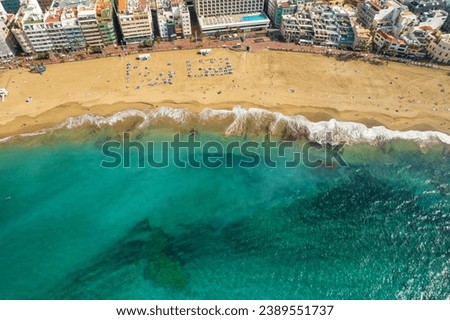 Playa de Las Canteras beach in Las Palmas town, Gran Canaria, Spain. Aerial view of Las Palmas de Gran Canaria, the capital city of the Canary Islands. Royalty-Free Stock Photo #2389551737