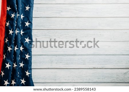 A patriotic scene for Veterans Day, American flags on a wooden background, symbolizing honor, pride, and democracy. November 11 is a day to celebrate our veterans.