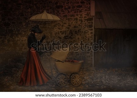 Victorian woman wearing a long red skirt, walking with a rattan carriage, down a pedestrian walkway lined by a fieldstone wall, on a gloomy autumn day Royalty-Free Stock Photo #2389567103