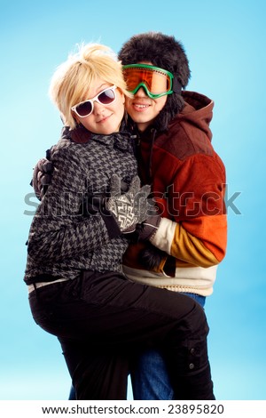 Happy young couple having fun winter themed image