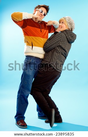Happy young couple having fun winter themed image