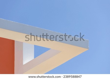 Abstract geometric shape architecture background. modern concrete structure building detail. white orange wall against blue sky. Part of exterior wall texture. Minimal, design, construction, corner