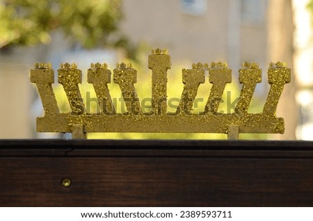 Hanukkah with wooden dreidels, menora,  sufganiyot, Chanukiahm coins shekel. Attributes of the Jewish holiday. 