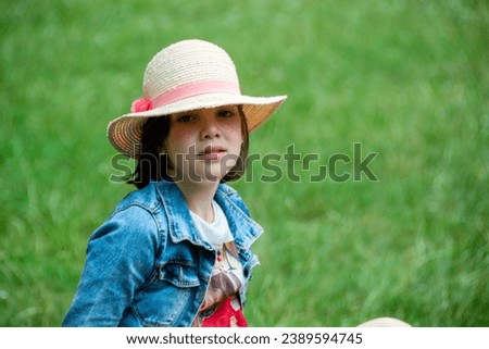Pretty girl in a hat relaxing on the brench, travel concept., travel concept. smiling cute little girl on beach vacation. Girl in hat in park. Beautiful girl in a white hat outdoor. High quality photo