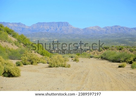 View of an Arizona train trestle in Mammoth, Pinal County, USA, from the Tucson Wash, in between the towns of Oro Valley, San Manuel, and Globe, in winter of 2022. Royalty-Free Stock Photo #2389597197