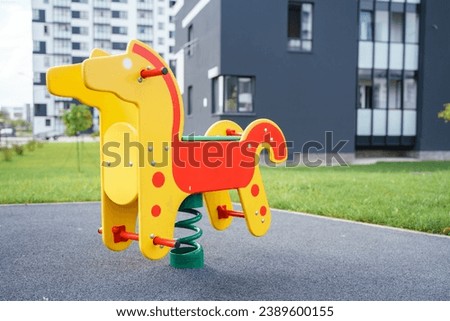 A horse on a spring on the playground