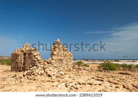 The abandoned ruins of the fishing village Curral Velho, Boa Vista, Cape Verde. Royalty-Free Stock Photo #2389613319