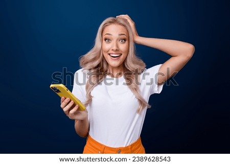 Photo of cheerful astonished girl wear stylish clothes rejoice unexpected unbelievable offer news isolated on dark blue color background Royalty-Free Stock Photo #2389628543