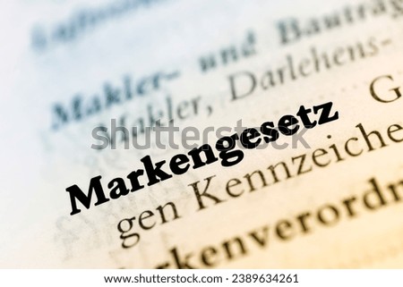 A close-up of a word in German dictionary with initial, definition and transcription