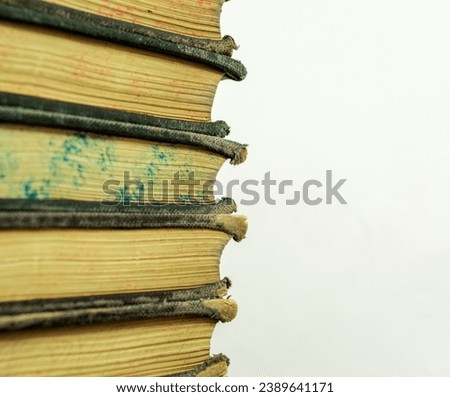 A stack of old books on a white background