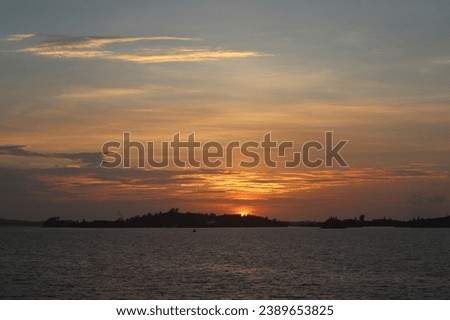 Dramatic Colourful Sunset Sky over Atlantic Ocean. Clouds with Sunrays. Cloudscape Nature Background Royalty-Free Stock Photo #2389653825