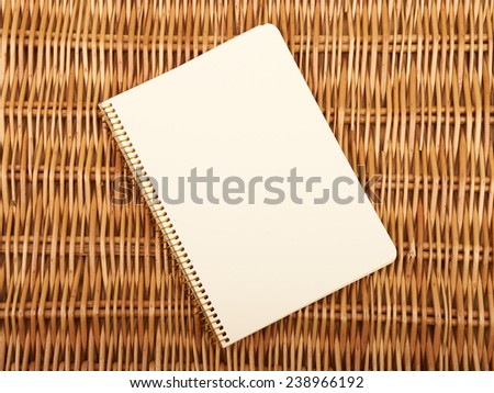 Notebook on  natural basket textures background
