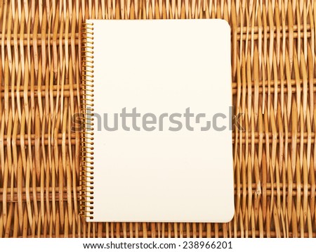 Notebook on  natural basket textures background
