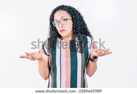 Afro girl with puzzled face frowning. Puzzled afro woman making hand gestures isolated. Puzzled people gesturing with hands Royalty-Free Stock Photo #2389665989