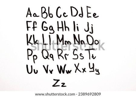 English alphabet, letters written with a marker on a blackboard. English alphabet, learning English, knowledge, education. Royalty-Free Stock Photo #2389692809