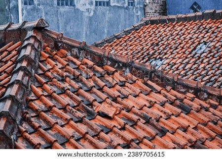 One of the wet roof tile miss the line, i took a picture after the rain from balcony.