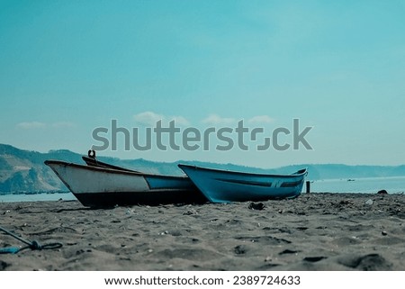 fishing boat anchored on the beach