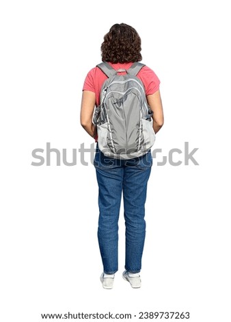 A curly-haired woman with a hiking backpack stands at full height. The backpack is on the back of a woman in a pink T-shirt. Cut out on white background for advertising and photomontage in 3d