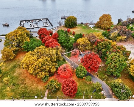 Aerial View of a Riverside Park with Fall Colors