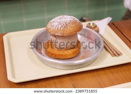 Sweet Symphony: Thai's Latest Craze - Fusion Bliss of Fried Mantou with Ice Cream Royalty-Free Stock Photo #2389751855