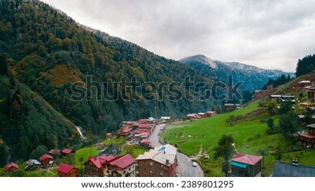 General landscape view of Ayder Plateau in Rize. Ayder Plateau has a wide meadow area with excellent nature views and wooden chalets. Rize, Camlihemsin, Turkey. Royalty-Free Stock Photo #2389801295
