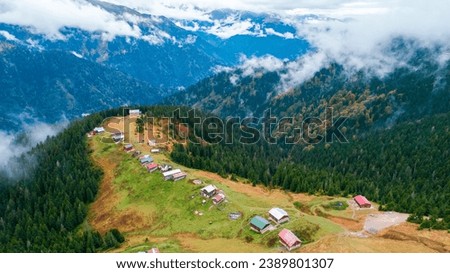 Mountain view and old plateau houses in Pokut Plateau in Rize and a magnificent landscape photo. Royalty-Free Stock Photo #2389801307