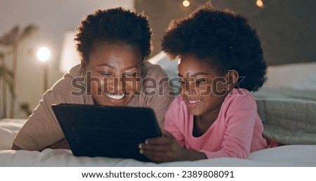 Mom, child and tablet in bedroom, watching cartoons and night time in bed, technology and laugh. Happy, enjoying and online for videos, digital and internet in home, streaming or bonding together