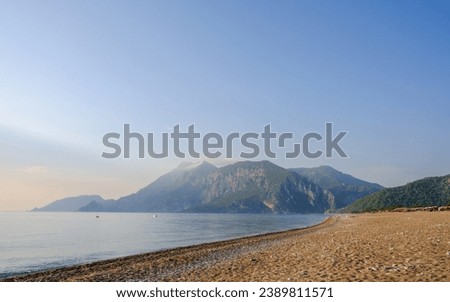 Captured the serene beauty of Cirali Beach in Antalya on a sunny summer day in 2023. An idyllic coastal scene, where the azure waters meet the golden sand, creating a picture-perfect seaside landscape