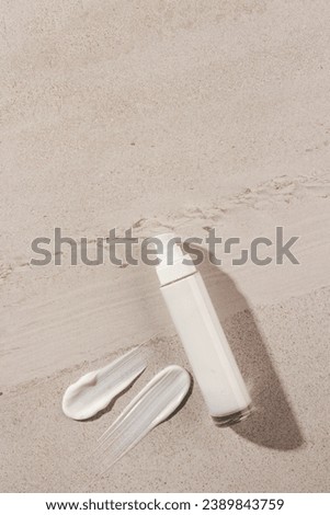 Vertical image of beauty product white bottle with pump, smudge copy space on stone background. Health and beauty, make up and beauty concept.